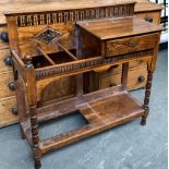 A carved oak hall stand, with single drawer and stick stand with undershelf (drip tray missing),