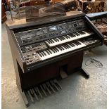 A Technics PCM Sound EX70 digital organ, with stool