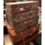 A lot of four vintage leather suitcases, three approx. 68cmW, the largest 81cmW