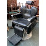 A black vinyl and chrome barbers chair with adjustable head rest, 70cmW