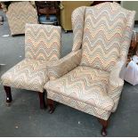 A wingback armchair, on cabriole legs, 80cmW; together with an upholstered chair in matching print