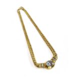 A yellow metal necklace set with white stones, marked '18ct' however tests as 9ct, the clasp