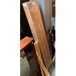 Three teak posts, 9x9x150cm; together with a number of pine banister spindles, 90cmH