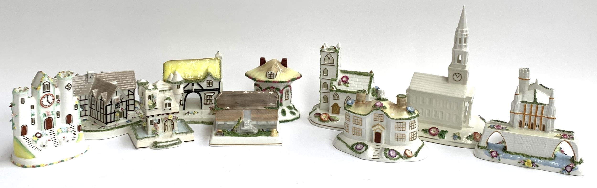 A lot of ten various Coalport ceramic cottages to include The Coaching Inn, Clock Tower,