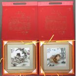 A pair of Chinese paintings on porcelain depicting Pekingese dogs, each in fitted velour lined carry