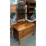 A 20th century oak dressing table, adjustable mirror, with two drawers, 91cmW