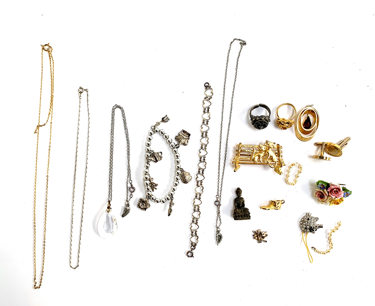 A small lot of jewellery to include white metal necklaces, white metal 'poison' ring with cannetille