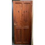 A pine four panel door, 77x196cm