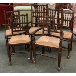 A set of six spindle back dining chairs, with rush seats, two carvers