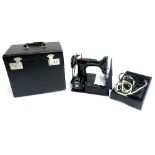 A 1950s electric Singer sewing machine model 221K, serial no. EF694539