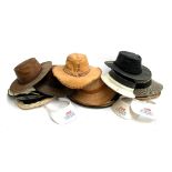 A collection of straw and other hats, 3 BBC clip on visors, several leather jacaru hats to include