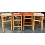 Two pairs of vintage beechwood kitchen stools, one pair with red vinyl seats, each approx. 52cmH