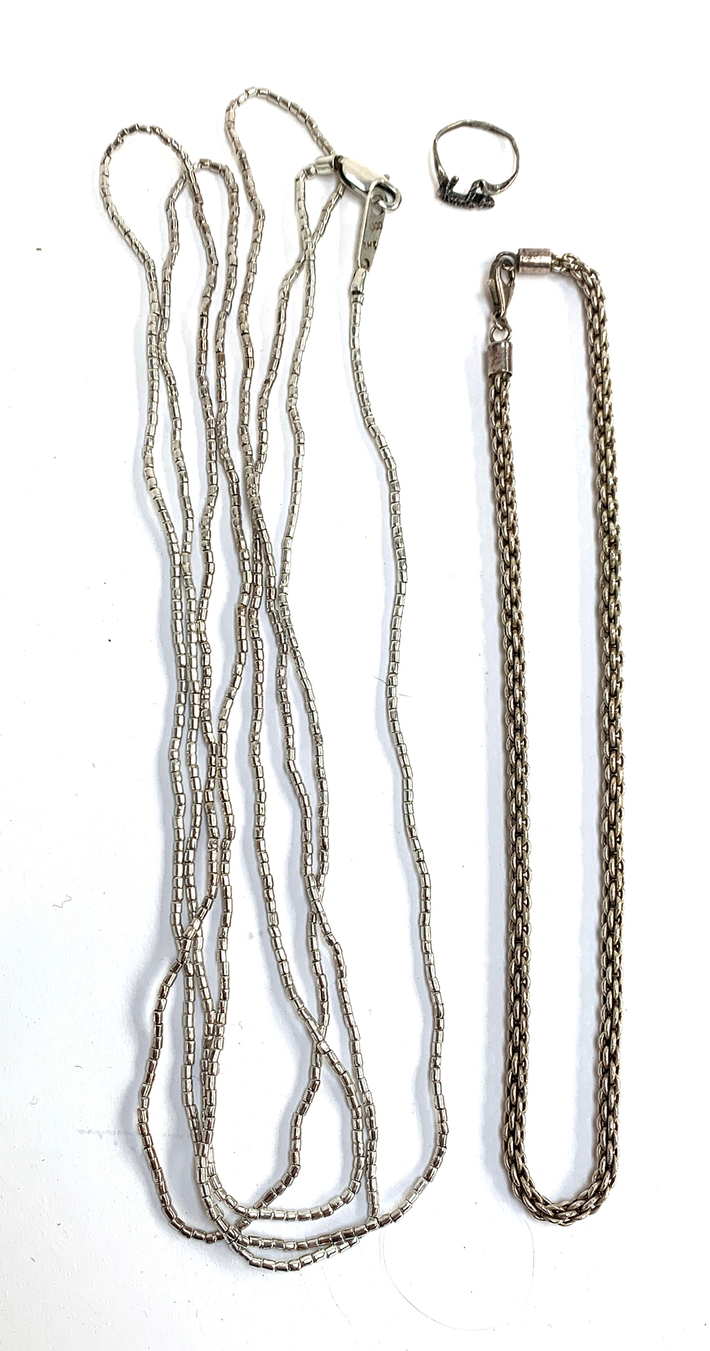 A 925 silver necklace, 28.2g, 41cmL; together with a very long silver necklace, 31.4g, 200cmL; and a