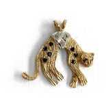A 9ct gold Cartier style panther charm, set with diamonds, sapphires and rubies, approx. 2g