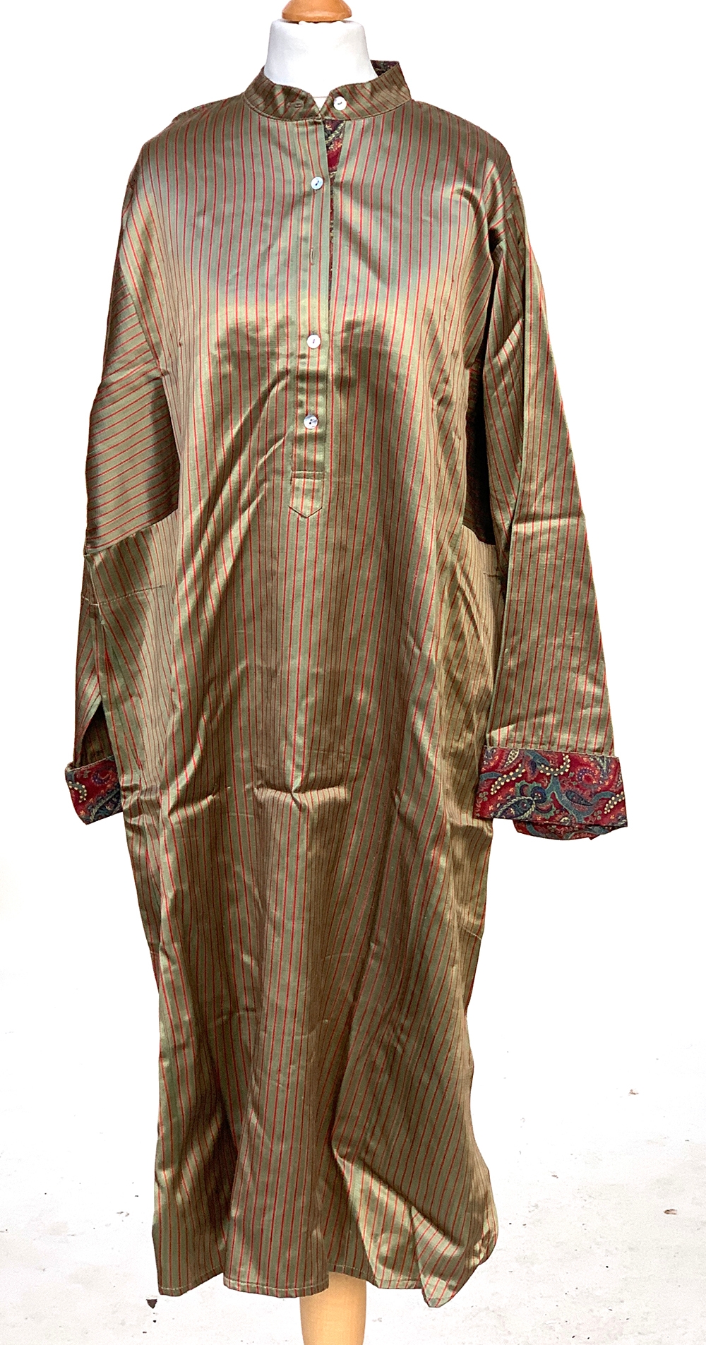 A man's striped tawhid tunic with paisley turned cuffs, Size L with label 'Orient 499' label in