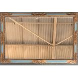 A gilt and painted rectangular wall mirror, 57x86cm