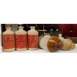 Three stoneware 'Propert's Scarlet Cloth Cleaning Fluid' bottles; together with three stoneware