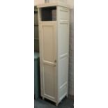 A painted pine narrow kitchen cupboard, with fielded panel sides and door, 48x41x198cmH