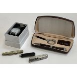 A new and boxed Tavistock & Jones radio controlled watch; faux crocodile skin desk set including