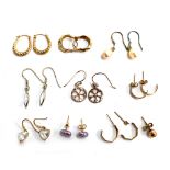A pair of 9ct gold horseshoe earrings, approx. 0.4g; together with a further pair of 9ct gold and