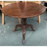 An early 19th century provincial oak tiptop birdcage table, on tripod legs, 63cmD 50cmH