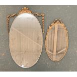 An early 20th century Adam's style oval wall mirror, 61cmH, together with one other smaller, 42cmH