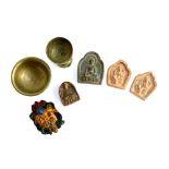 Four very small clay Buddhist tokens, the largest 4.2cmH, together with 2 very small brass bowls and