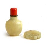 A jade snuff bottle with coral coloured stopper with spoon, 7.2cmH, together with a jade