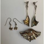 A pair of silver earrings in the form of ginko leaves 7.5cmL, together with a matching brooch set