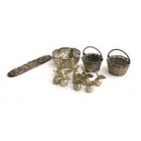 A pair of white metal Indian baskets; a number of white metal menu holders in the form of apples,