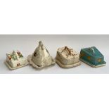 A lot of four ceramic cheese cloches, two with Prunus design