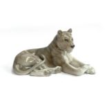 A Royal Copenhagen porcelain recumbent Lioness, number 804, marked to base, 31cm long