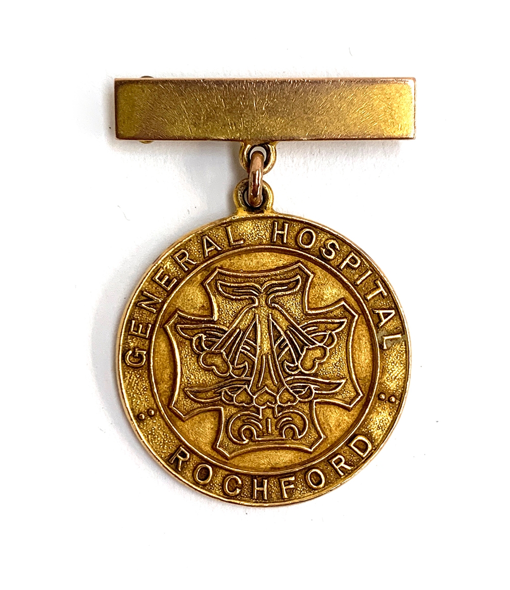 A 9ct gold Rochford General Hospital medal, engraved Julie M. Rolfe, October 1955 on reverse,