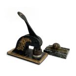A brass snail pen rest, together with a desktop letter press, reading H Henry (Textiles Limited)