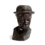 An African hardwood carved bust of a man smoking a pipe, 23.5cmH, marked to base Ibra Swazi
