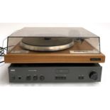 A Dual CS5000 turntable on a teak base; together with a NAD stereo amplifier 3020e and a pair of NAD