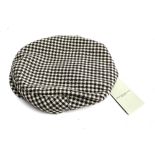 A Holland & Holland wool herringbone tweed cap (brown and navy), size XL