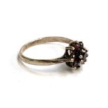 A silver ring set with bohemian garnets in a floral cluster, formerly gold plated, approx. 1.6g,