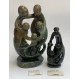Two Zimbabwean carved serpentine figures, 34cmH and 26cmH