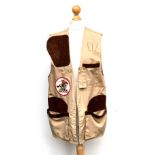 A Straight Mate shooting gilet, size L, with Winchester Rifles badge