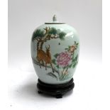 A Chinese ginger jar on stand, depicting a deer, character marks to reverse, 30cmH