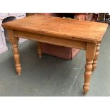A 20th century pine kitchen table, on turned legs, 75x120x79cmH