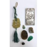 A mixed lot of Chinese jade items to include a bird in foliage, leaping fish, pig medallion, white