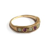 A 9ct gold ring set with opals and rubies, approx. 2.4g, size P 1/2