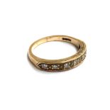 A 9ct gold and diamond band ring, approx. 2.8g, size P
