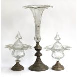 A pair of cut glass lidded urns with loaded white metal bases (af), 28.5cmH, together with a large
