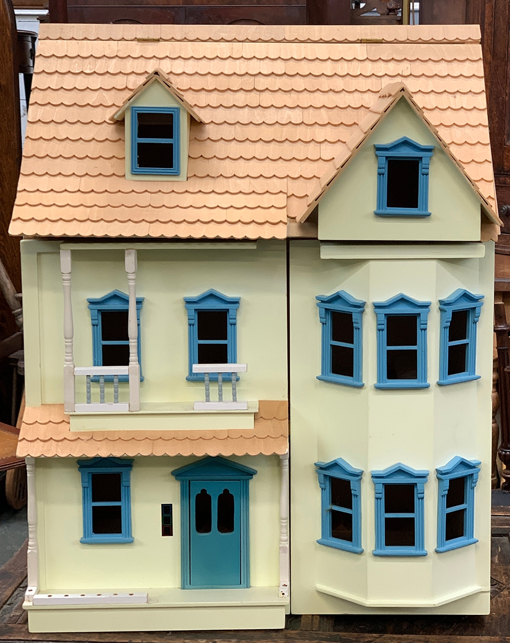 A 20th century painted dolls house, 53cmW