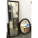An early 20th century dressing mirror, 37x130cm, together with an oval wall mirror with bevelled