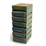 A vintage 'Tewel' motor production storage cabinet comprising six sliding lidded tins/drawers, 36.