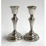 A pair of loaded silver candlesticks, hallmarked Birmingham, 1979, 15.5cmH